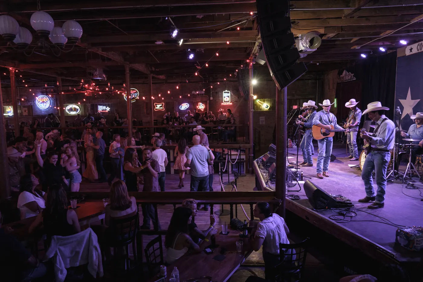 All Hat No Cadillac on stage at Coupland Dance Hall with a full house