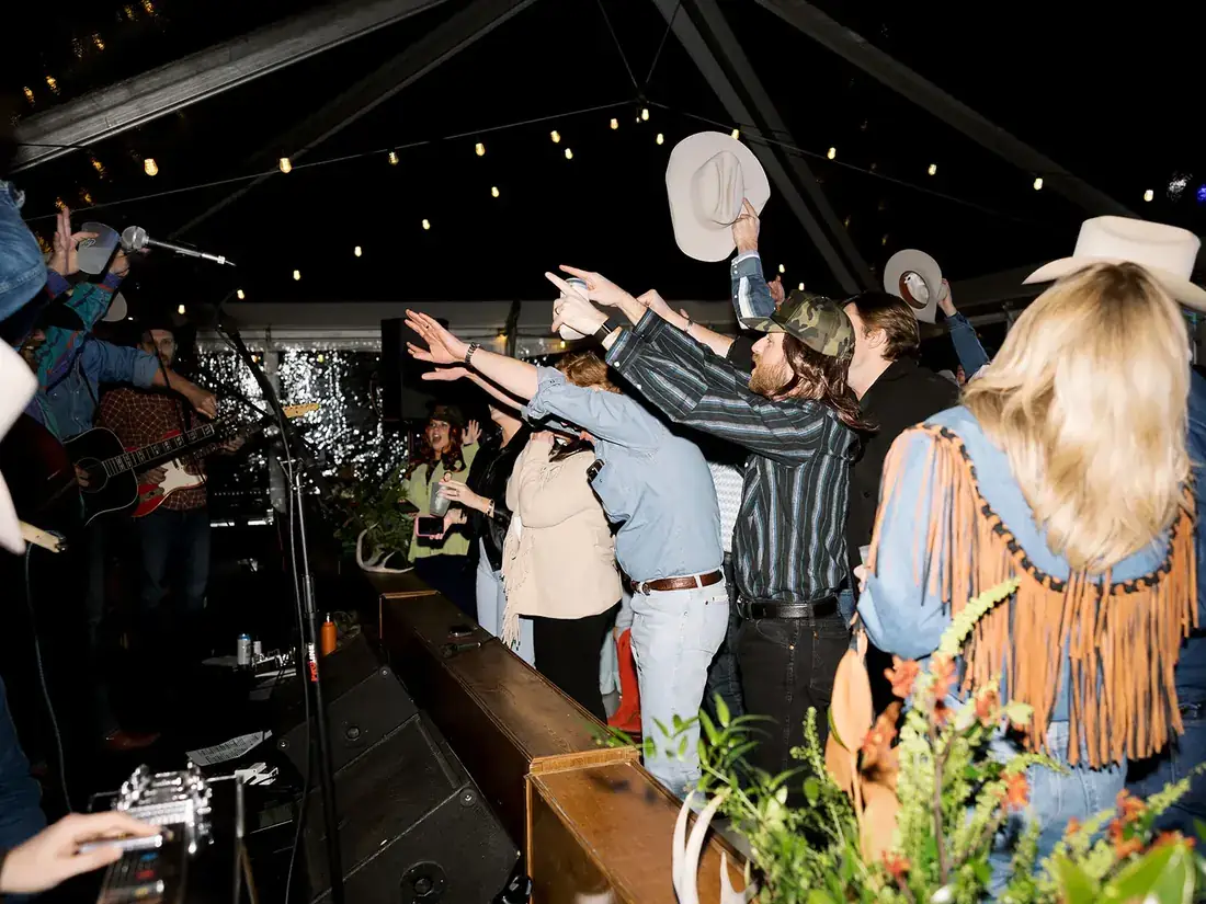 Crowd celebrating at All Hat No Cadillac private party