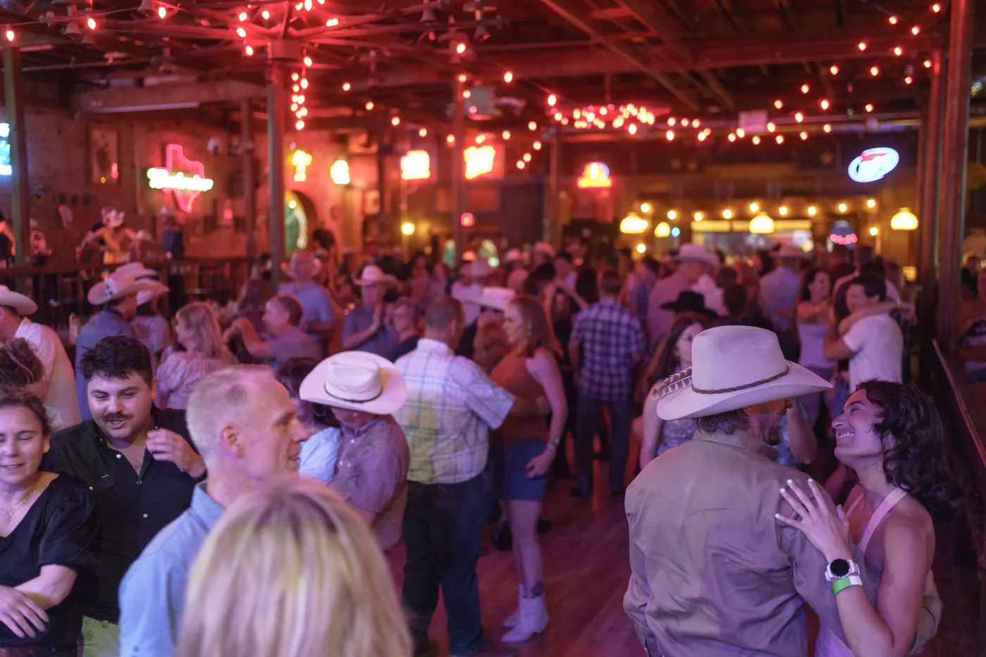 Full dance floor at an All Hat No Cadillac event in Texas