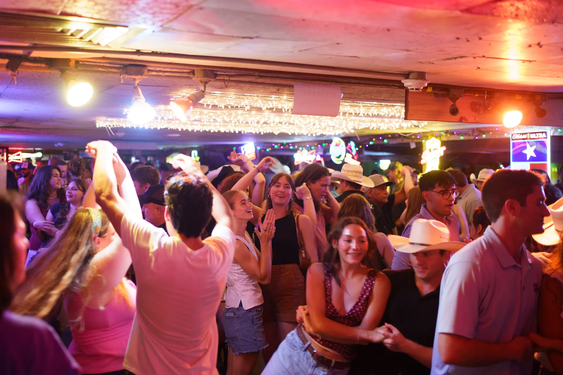 Packed dance floor at an All Hat No Cadillac show at the Broken Spoke in Austin