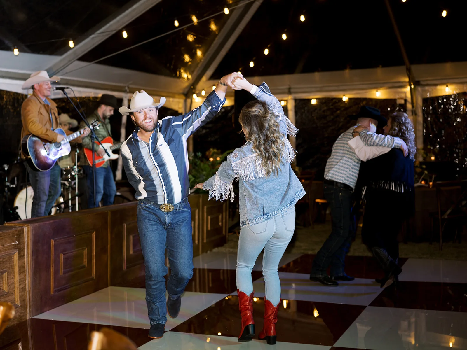 Couple two-stepping at private party with All Hat No Cadillac